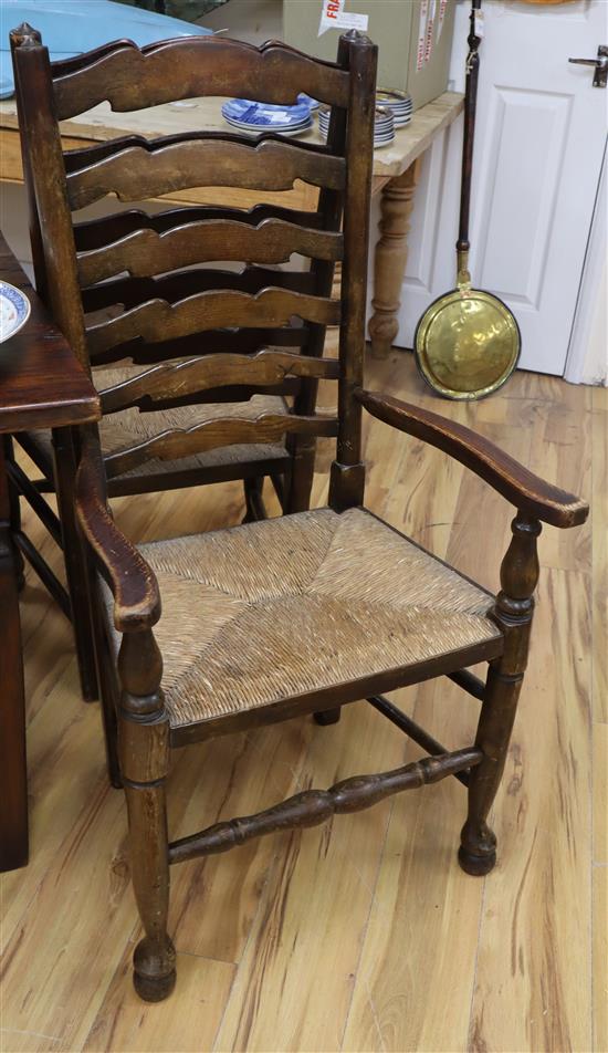 A set of six ash rush seated ladder back dining chairs (one arm with arms)
